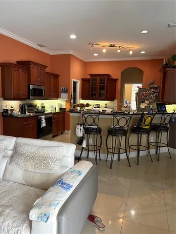 a kitchen with a table and chairs in it