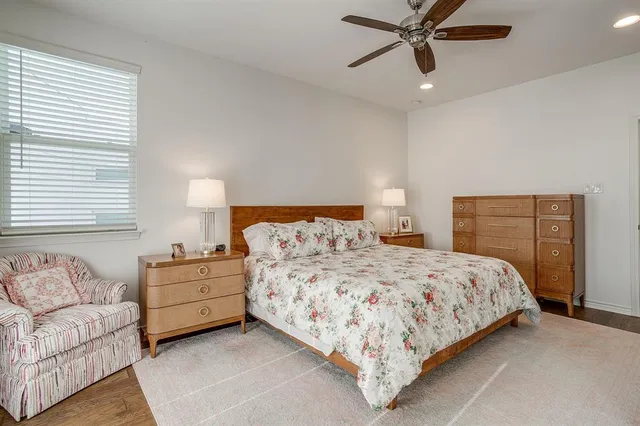 a bedroom with bed and window
