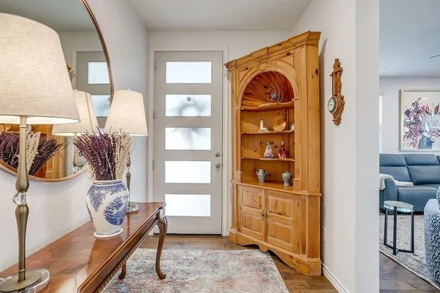 a view of front door and livingroom with furniture