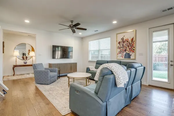 a living room with furniture and a large window