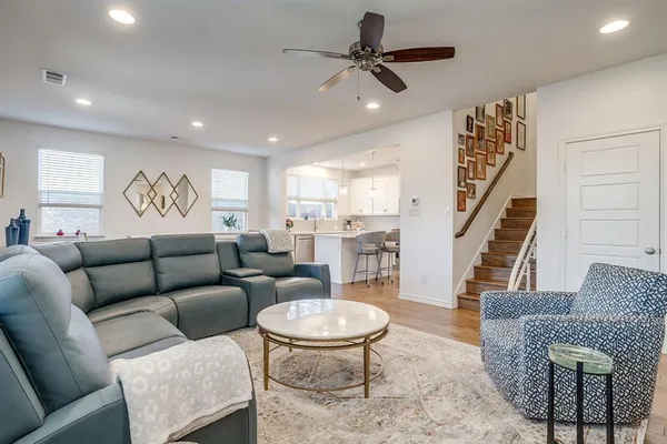 a living room with furniture and a rug