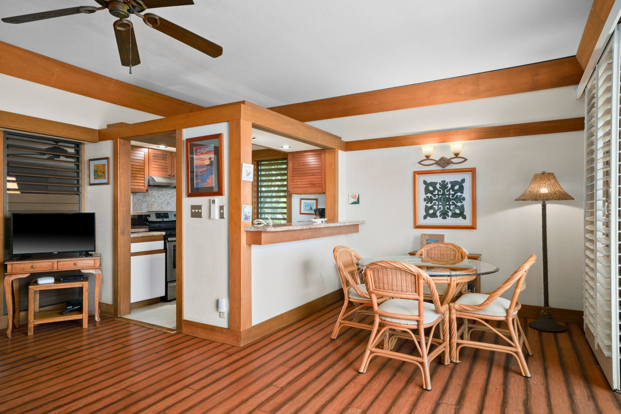 2253 Poipu Road, Unit 330 Koloa, HI 96756 - Photo 8 of 26 a dining room with furniture and wooden floor