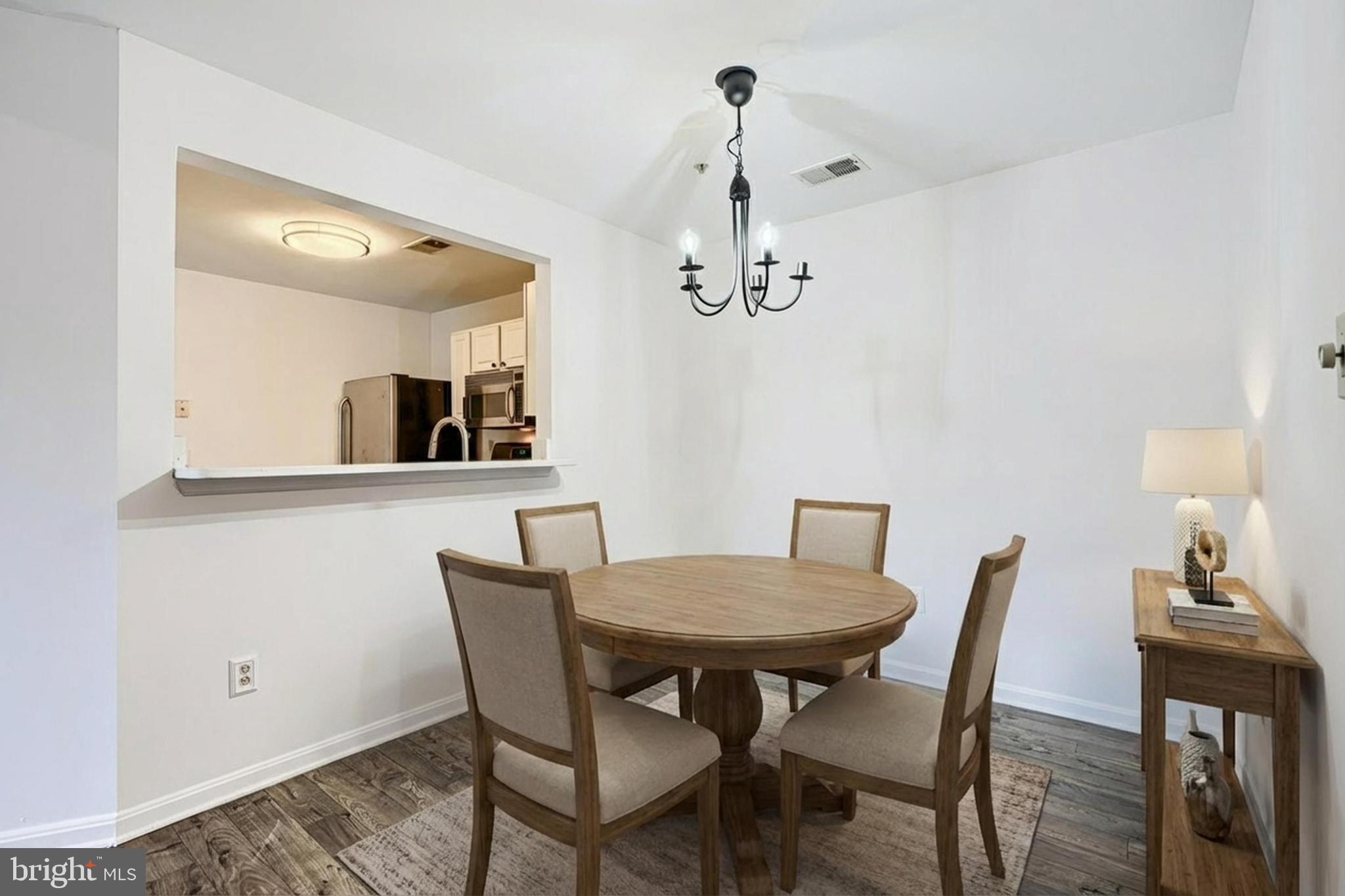 8803 Stoneridge Circle, Unit 301 Pikesville, MD 21208 - Photo 4 of 35 Virtually Staged- Dinning area