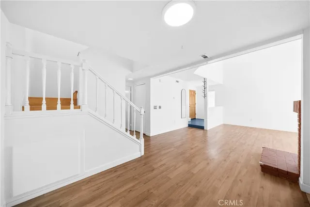 a view of an entryway with wooden floor