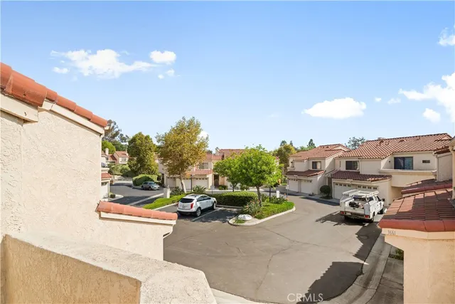 a bathroom with a granite countertop sink a mirror a bathtub and shower