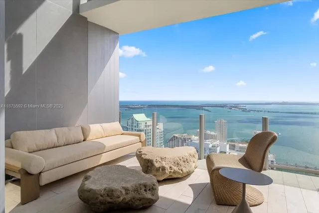 a large white kitchen with granite countertop a sink and dishwasher a stove top oven with granite countertops