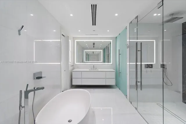 a view of swimming pool with outdoor seating and plants