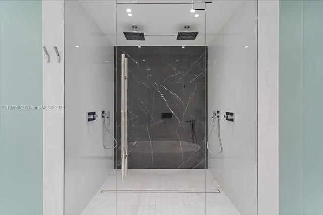 a living room with patio furniture and a large window