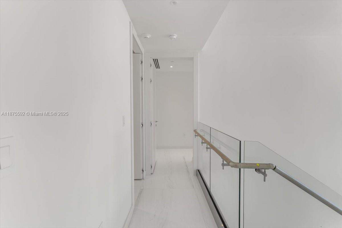300 Biscayne Blvd Way, Unit 5002 Miami, FL 33131 - Photo 41 of 69 a view of a hallway with white walls