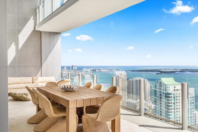 a living room with furniture and a large mirror