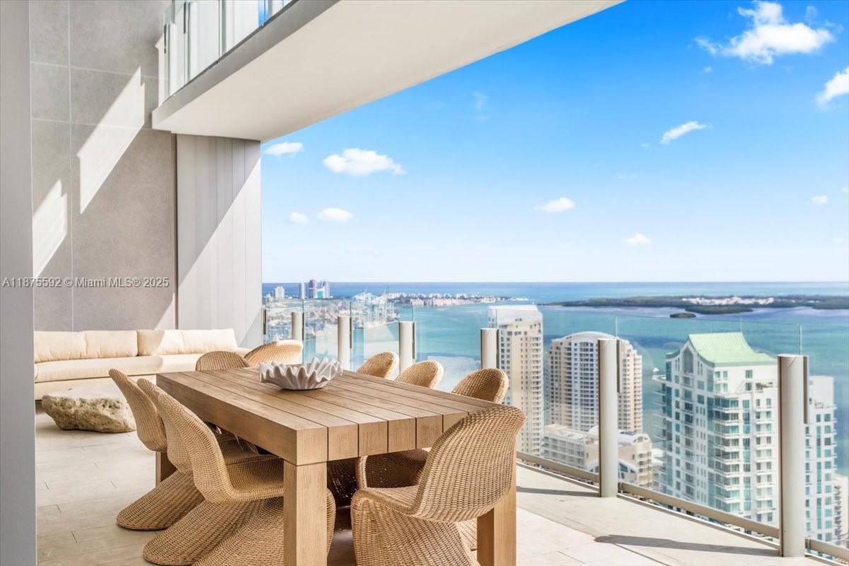 300 Biscayne Blvd Way, Unit 5002 Miami, FL 33131 - Photo 6 of 69 a view of a dining room with furniture and chandelier