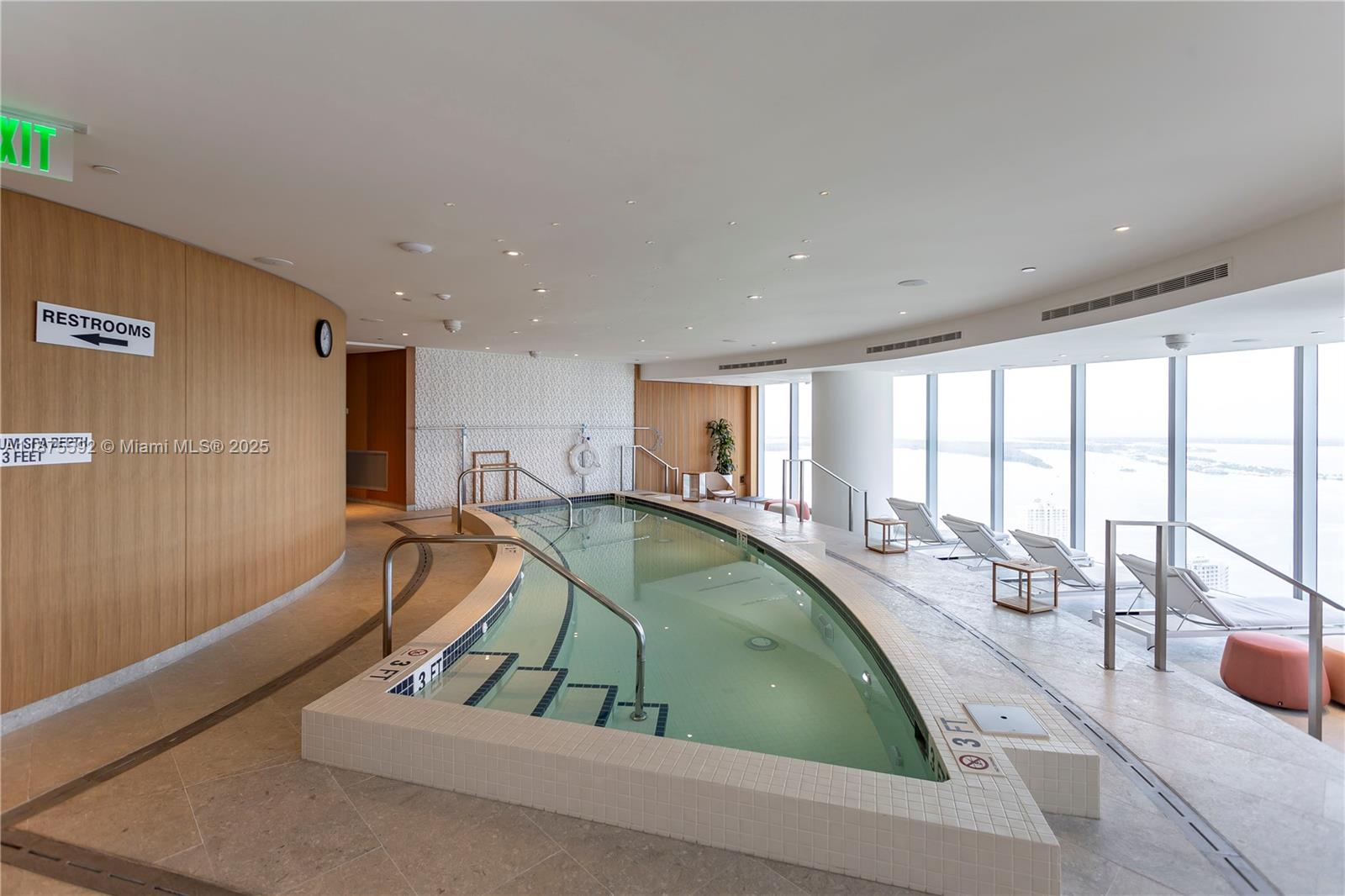 300 Biscayne Blvd Way, Unit 5002 Miami, FL 33131 - Photo 66 of 69 a room with lots of windows and tables