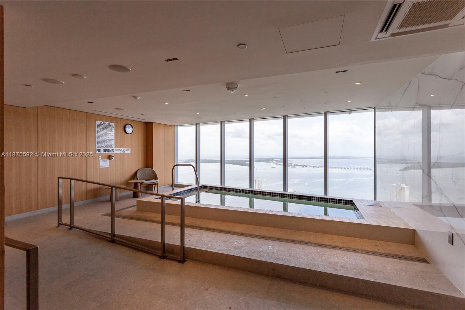 300 Biscayne Blvd Way, Unit 5002 Miami, FL 33131 - Photo 67 of 69 a spacious bedroom with a bed and a large window