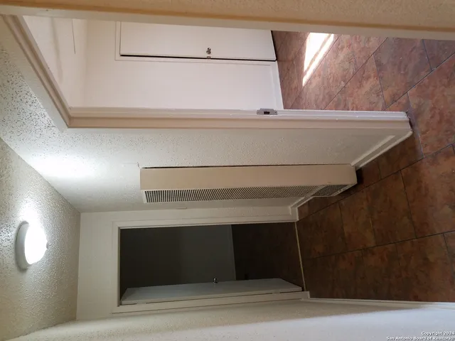 a view of walk in closet with window