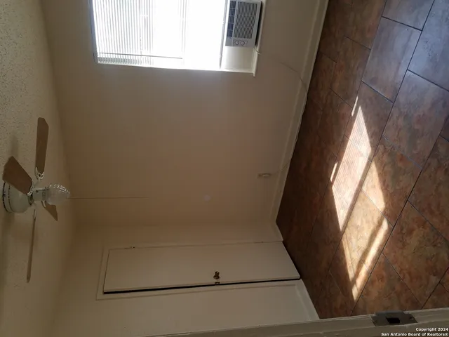 a view of staircase with wooden floor