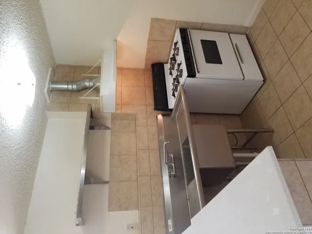 a bathroom with a toilet sink and tub