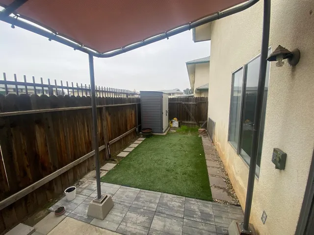 a view of a balcony with wooden floor
