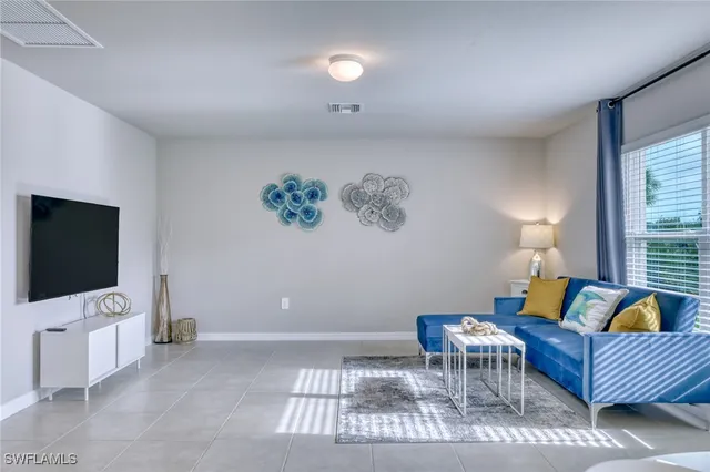 a bedroom with a bed and chair