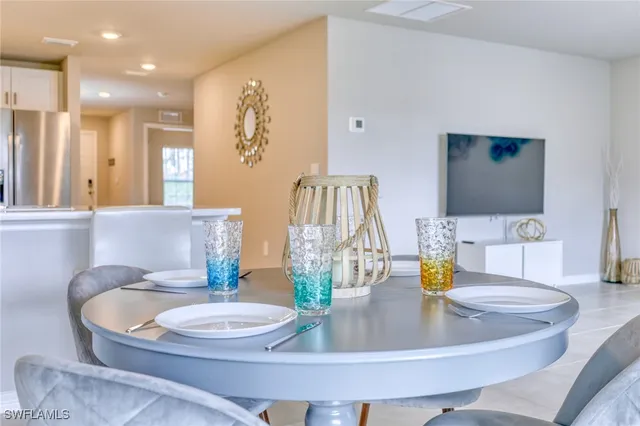 a living room with furniture and a lamp