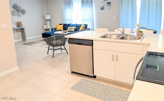 a room with a sink and a mirror