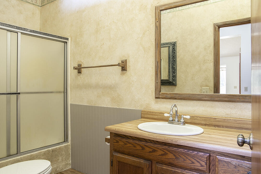 3536 Galice Road Merlin, OR 97532 - Photo 9 of 32 a bathroom with a sink and a mirror