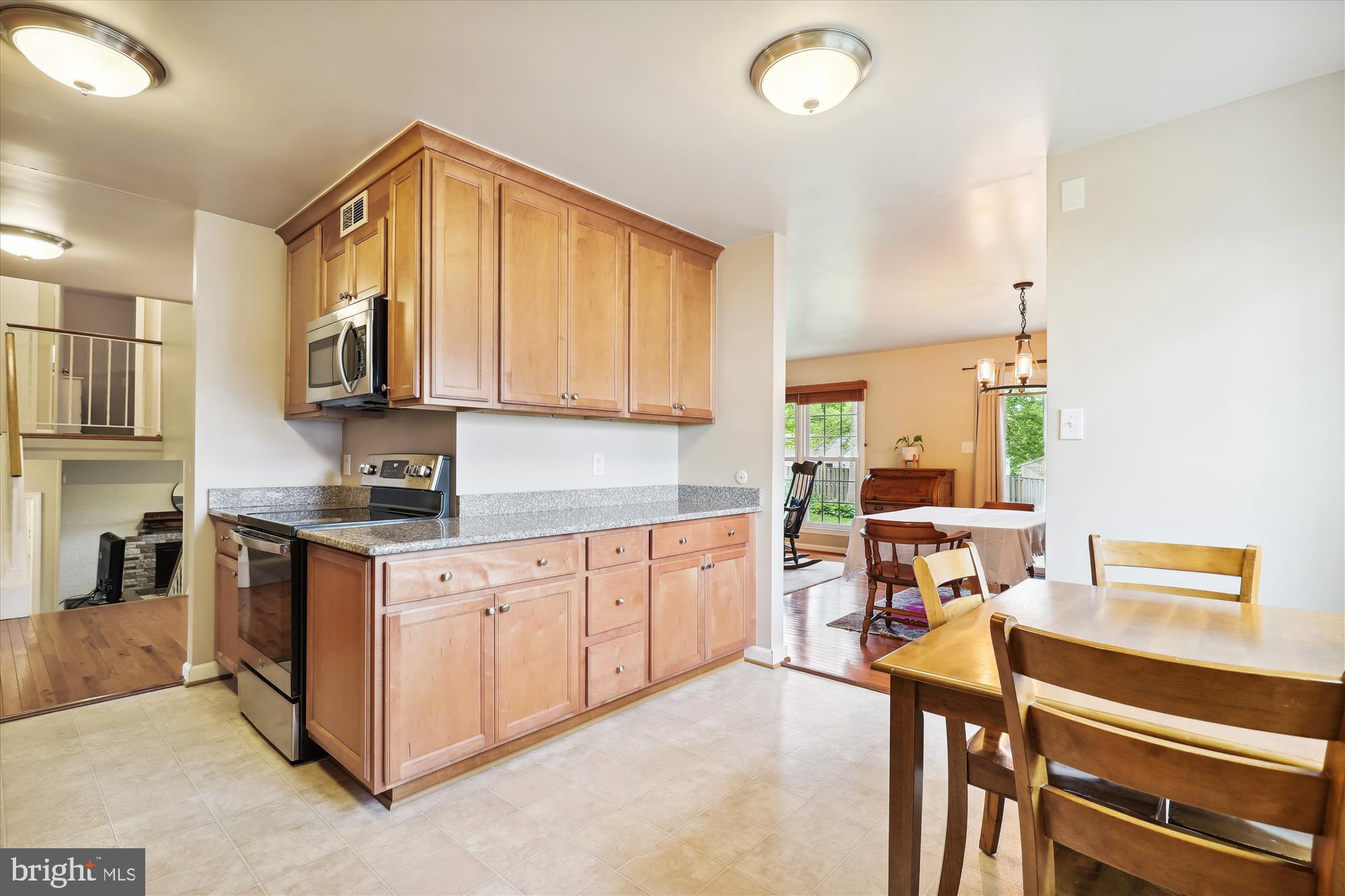 8322 Riverside Road Alexandria, VA 22308 - Photo 11 of 38 a kitchen with stainless steel appliances granite countertop a stove a sink and a refrigerator