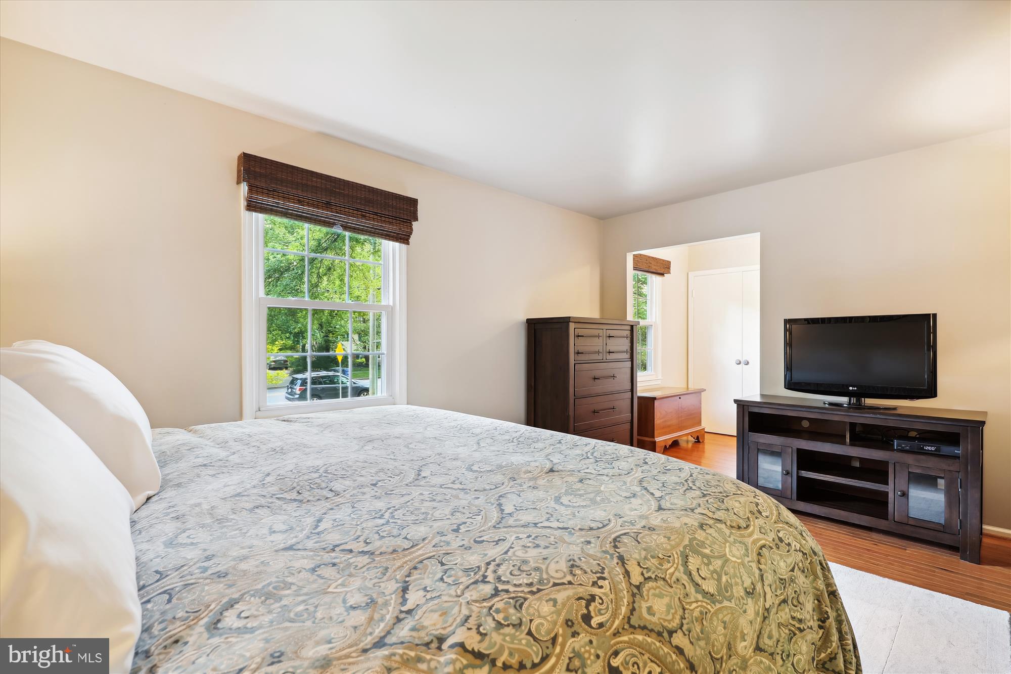 8322 Riverside Road Alexandria, VA 22308 - Photo 14 of 38 a bedroom with a bed and a flat screen tv