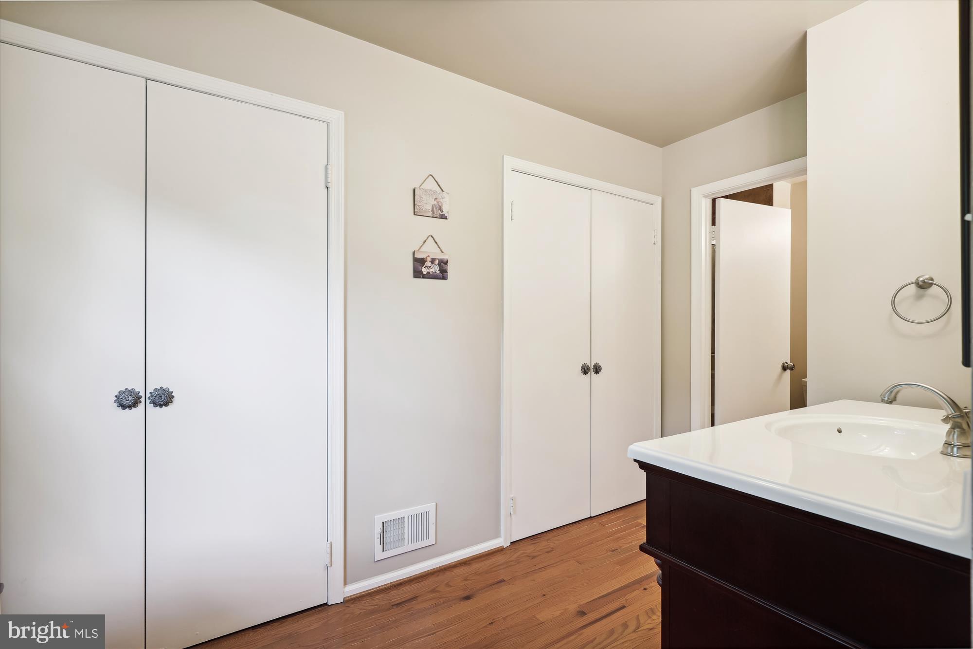 8322 Riverside Road Alexandria, VA 22308 - Photo 16 of 38 a bathroom with a sink and a mirror