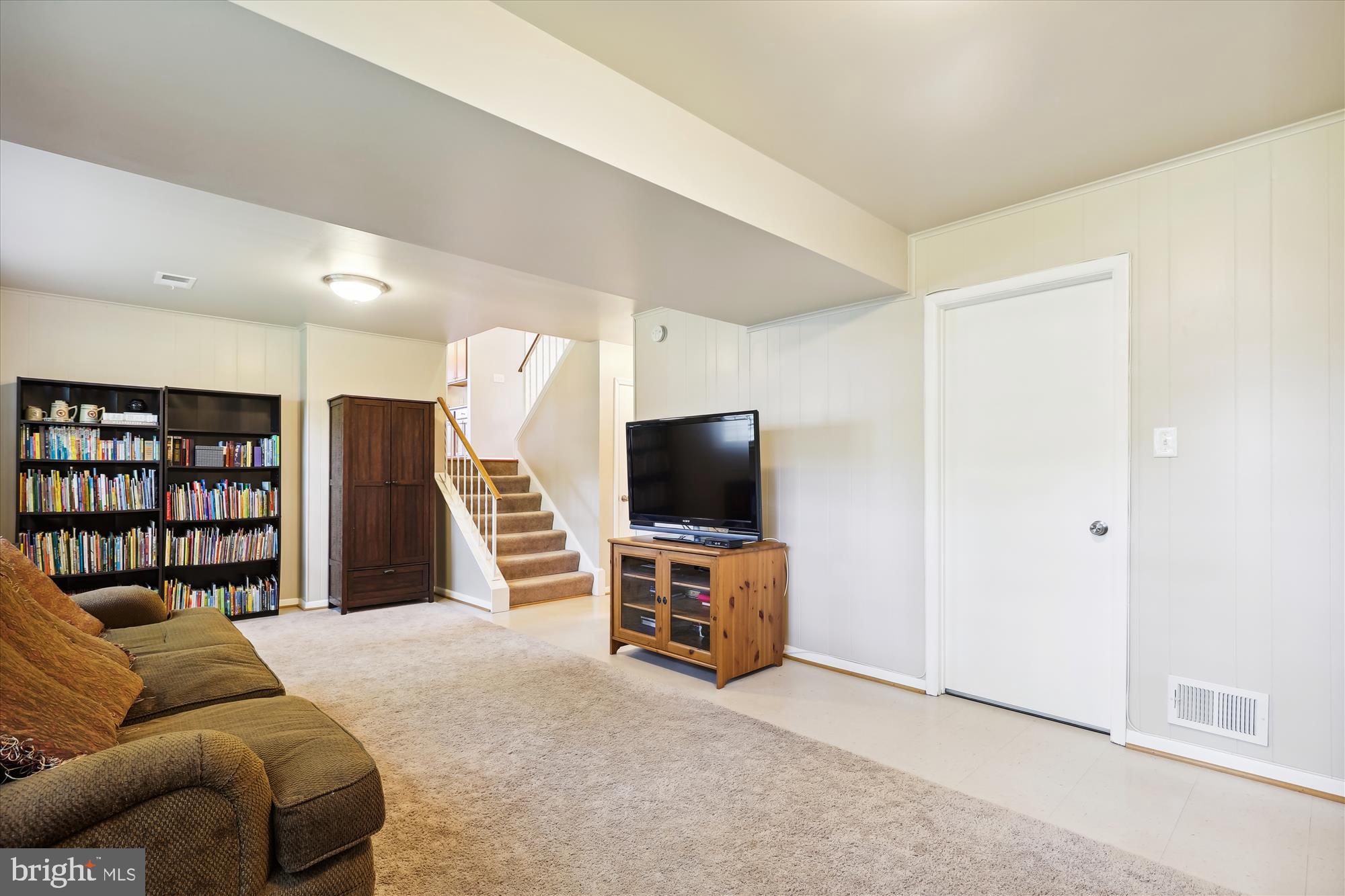 8322 Riverside Road Alexandria, VA 22308 - Photo 23 of 38 a living room with furniture and a flat screen tv