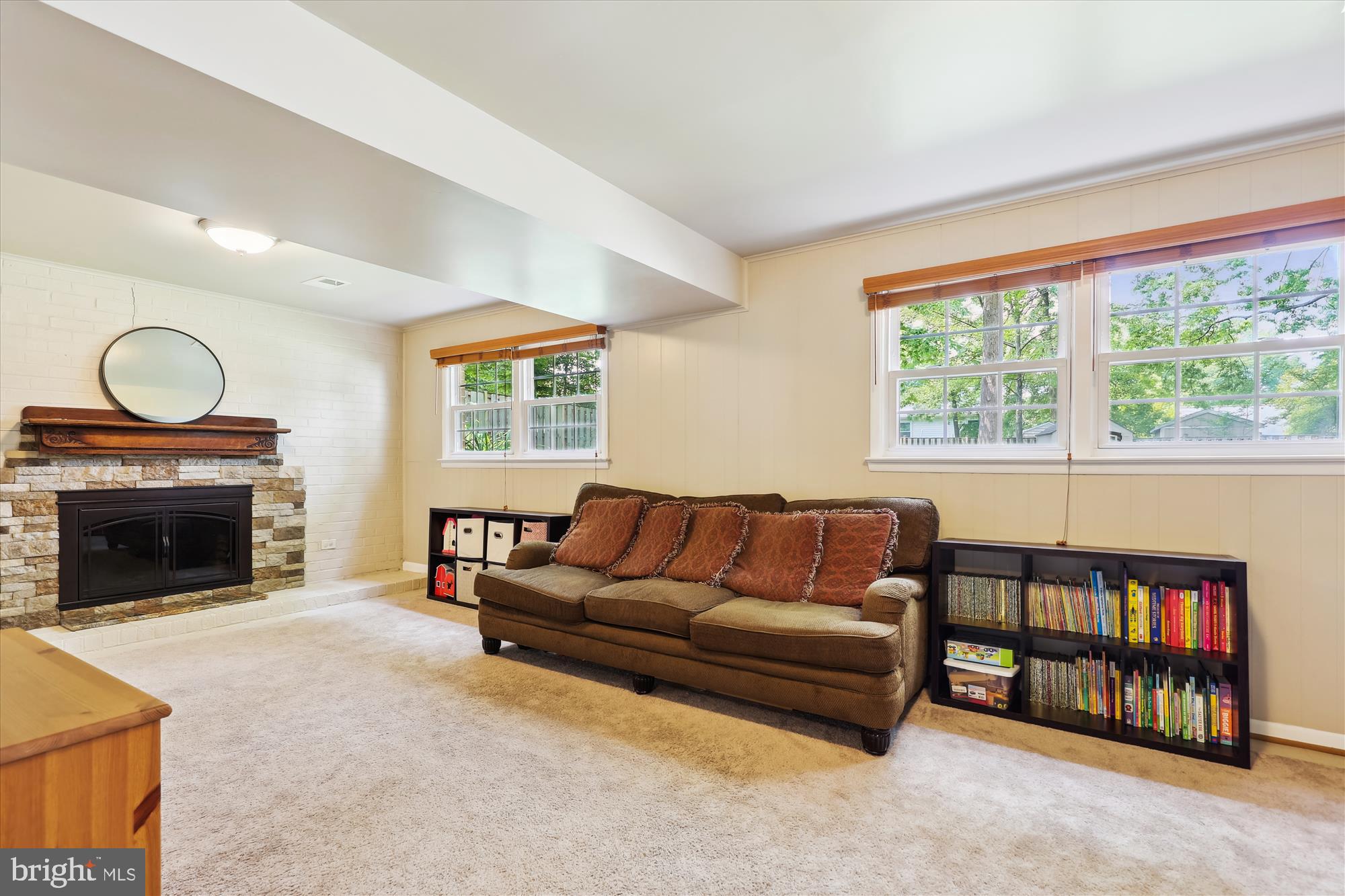 8322 Riverside Road Alexandria, VA 22308 - Photo 25 of 38 a living room with furniture a fireplace and a large window