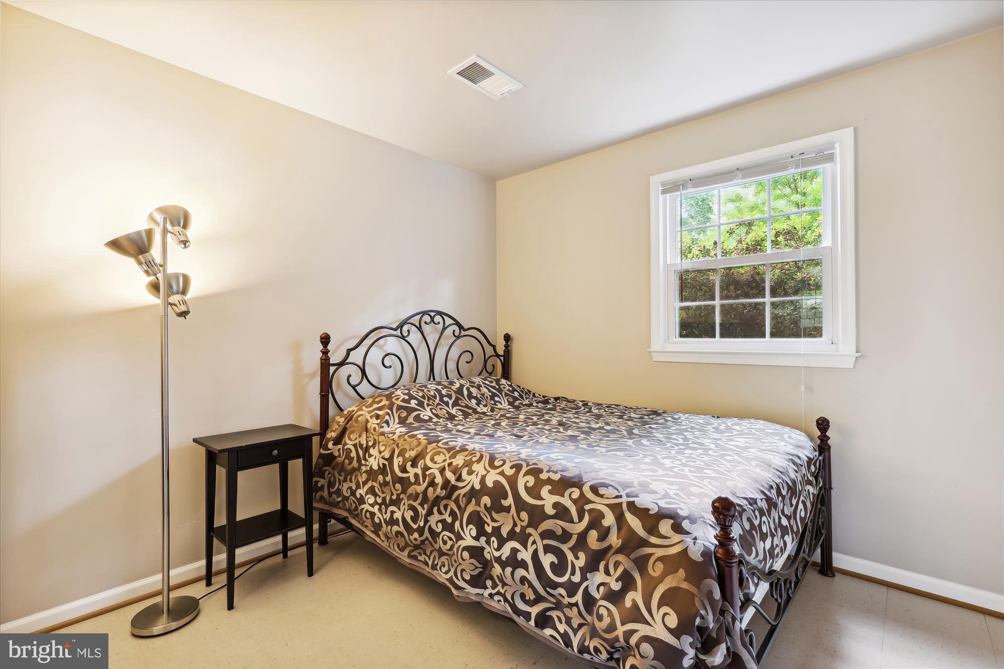 8322 Riverside Road Alexandria, VA 22308 - Photo 27 of 38 a bedroom with a bed and a window