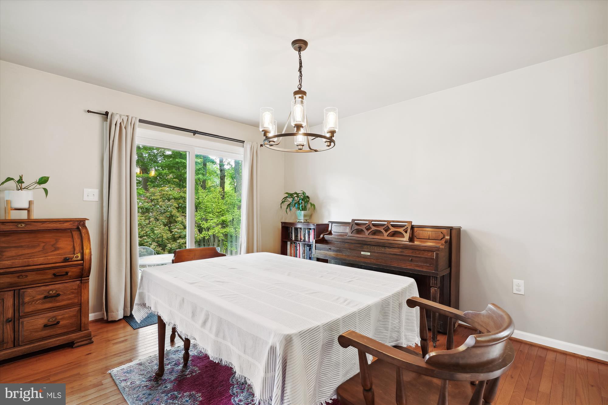 8322 Riverside Road Alexandria, VA 22308 - Photo 6 of 38 a view of a dining room with furniture window and wooden floor