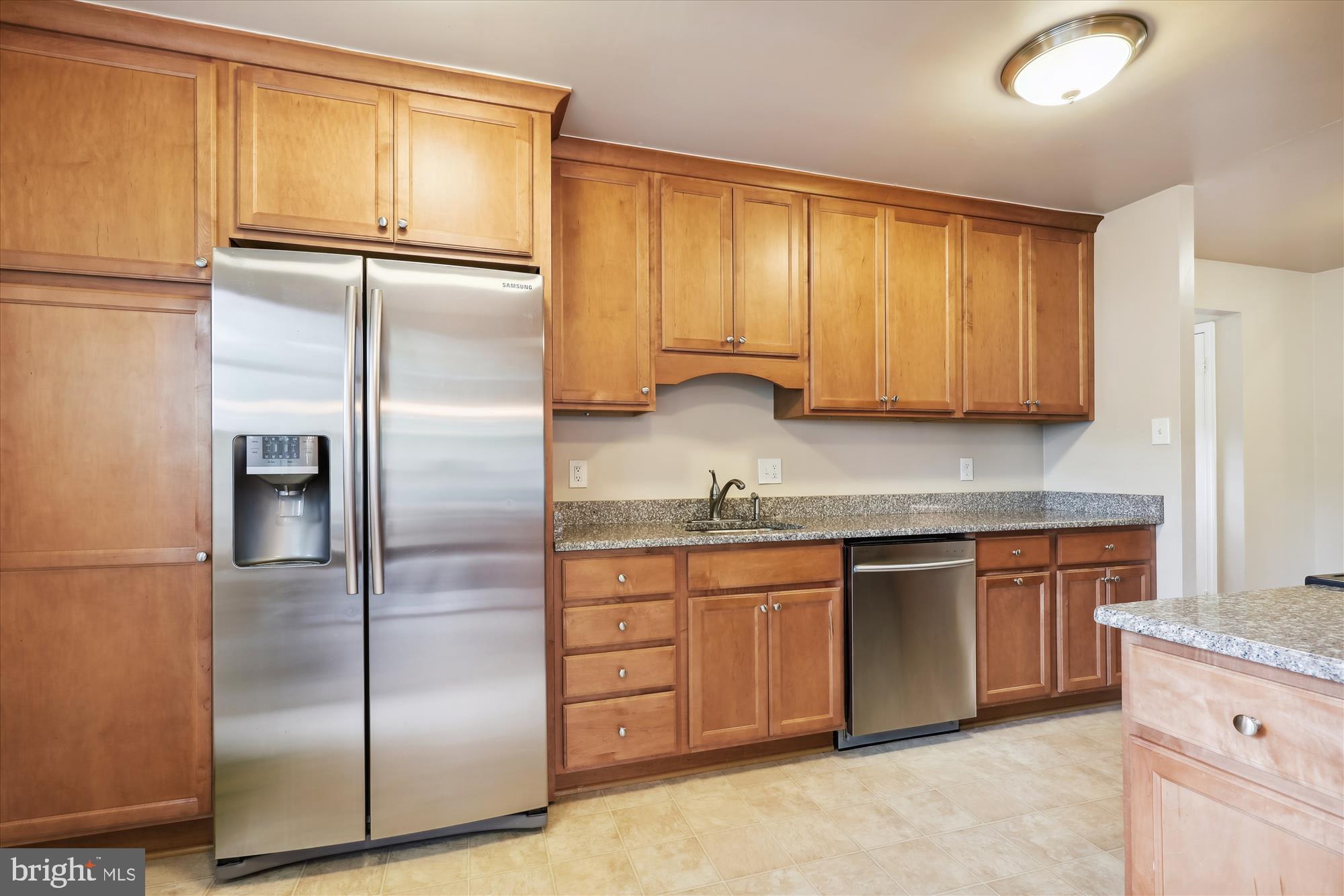 8322 Riverside Road Alexandria, VA 22308 - Photo 9 of 38 a kitchen with stainless steel appliances granite countertop a refrigerator a sink and dishwasher