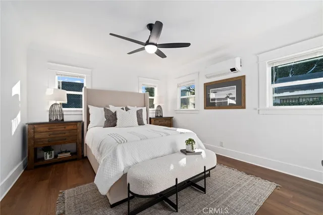 a bed room with a bed and a window