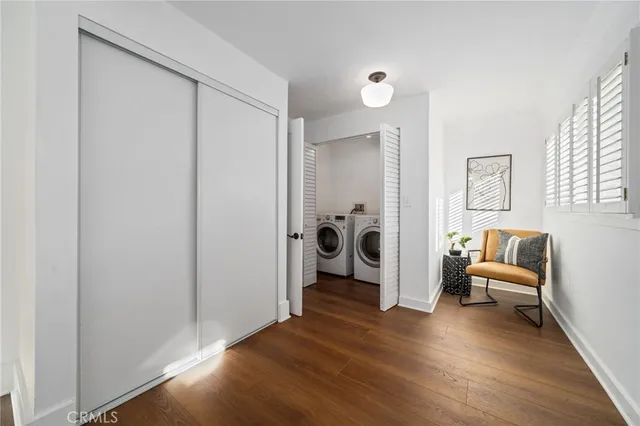 a view of a livingroom with furniture and wooden floor