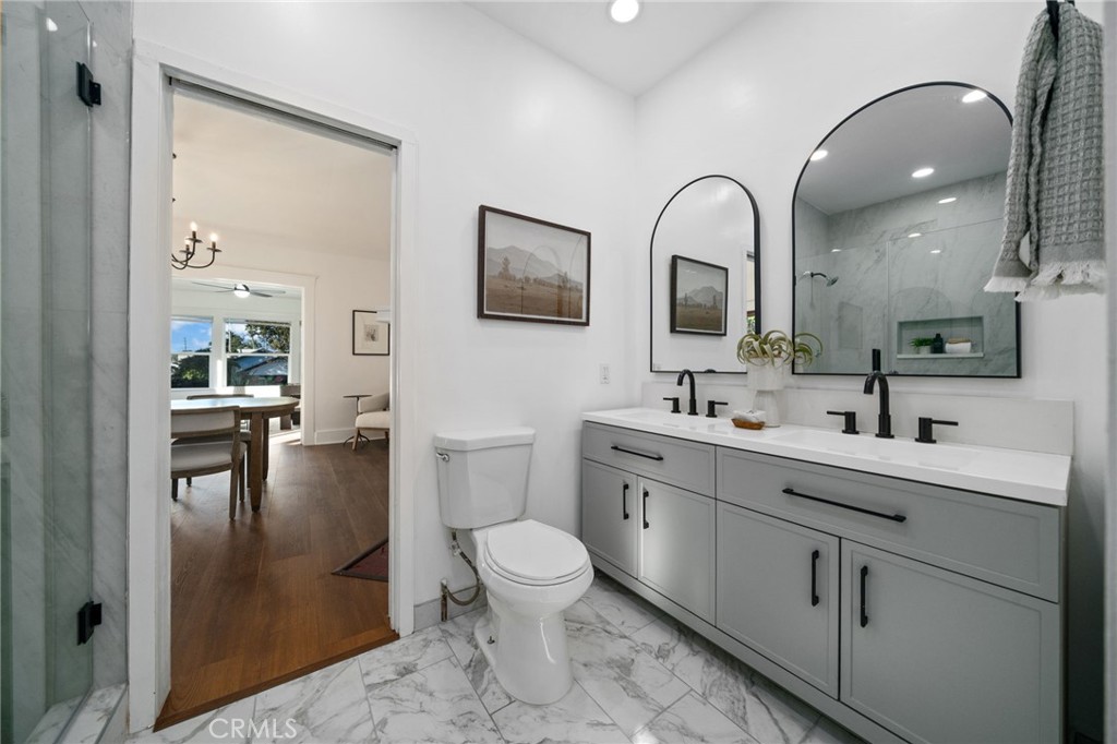 1148 Chestnut Avenue Long Beach, CA 90813 - Photo 17 of 32 a spacious bathroom with a toilet sink and mirror