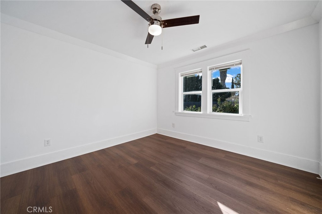 1148 Chestnut Avenue Long Beach, CA 90813 - Photo 25 of 32 an empty room with wooden floor and windows