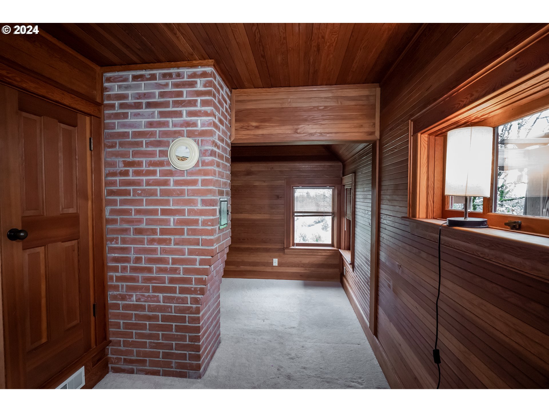 504 Spyglass Drive Eugene, OR 97401 - Photo 25 of 48 a view of empty room with a fireplace and windows