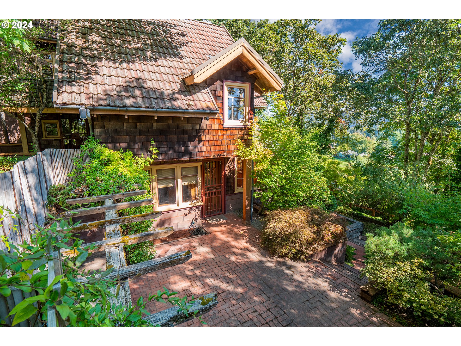 504 Spyglass Drive Eugene, OR 97401 - Photo 37 of 48 a view of a house with brick walls and a yard