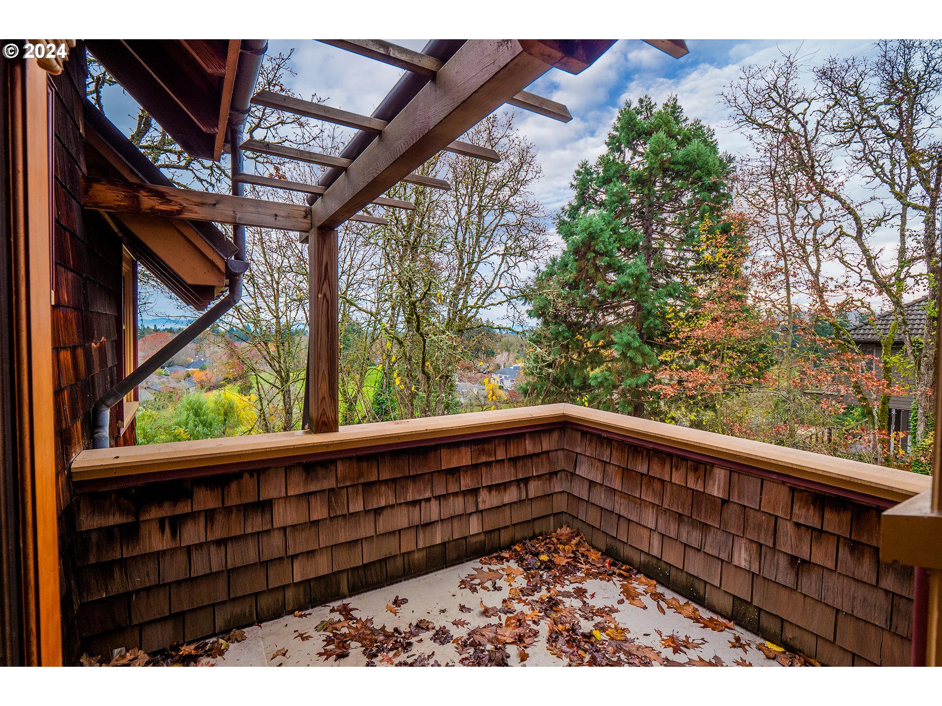 504 Spyglass Drive Eugene, OR 97401 - Photo 46 of 48 a view of a balcony with wooden fence and floor