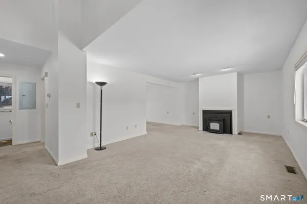 an empty room with fireplace