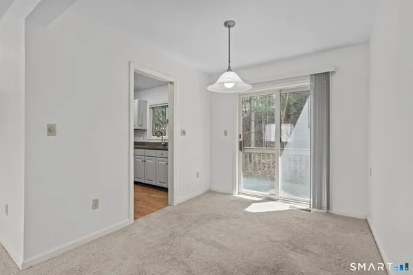 a view of livingroom with furniture outdoor view and window