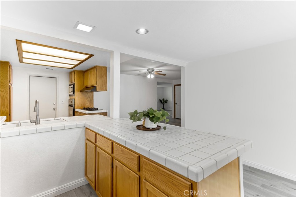 22246 Cardinal Street Grand Terrace, CA 92313 - Photo 12 of 28 a bathroom with a sink a vanity and a mirror