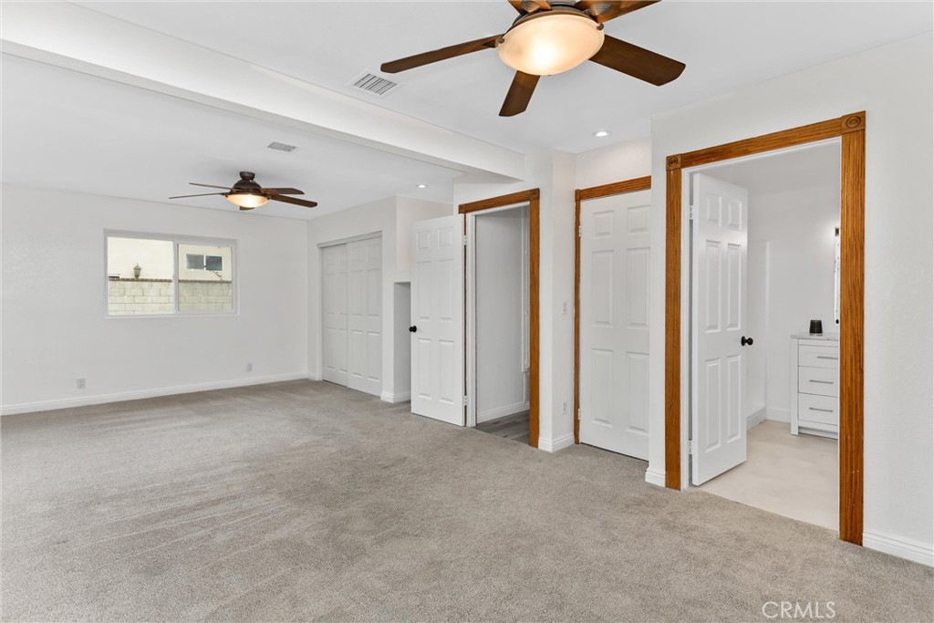 22246 Cardinal Street Grand Terrace, CA 92313 - Photo 19 of 28 an empty room with closet and a ceiling fan