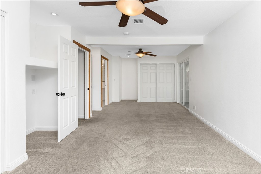 22246 Cardinal Street Grand Terrace, CA 92313 - Photo 20 of 28 a view of a livingroom with a ceiling fan and window