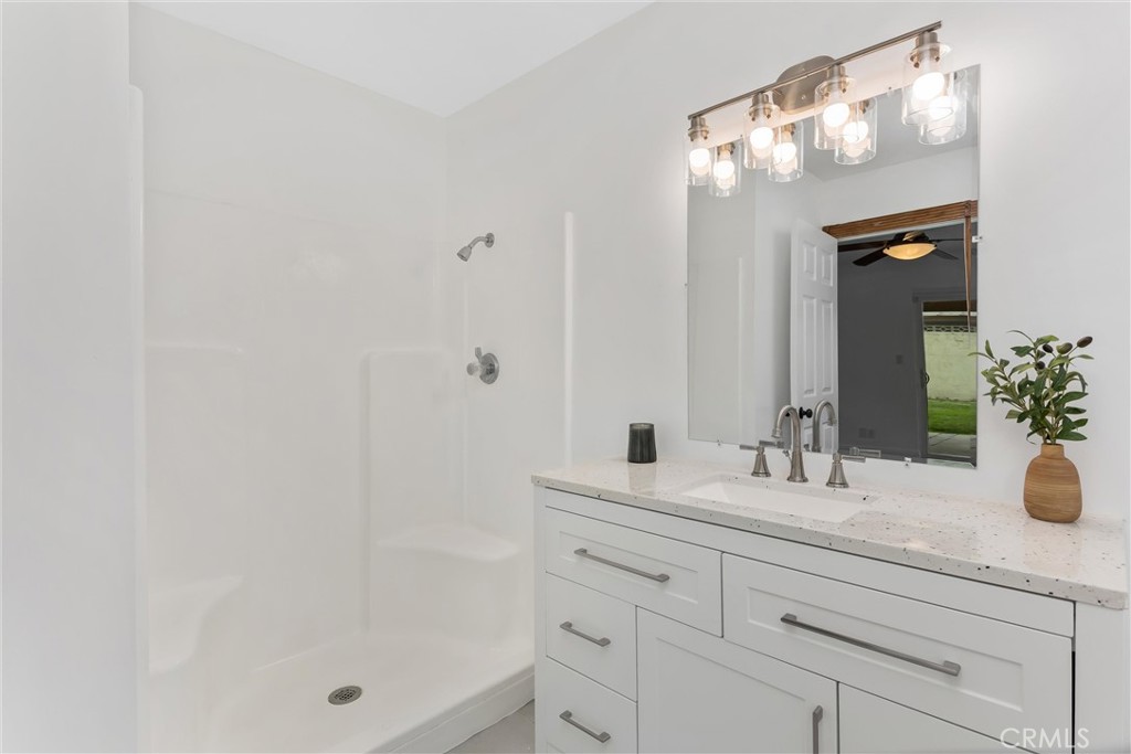 22246 Cardinal Street Grand Terrace, CA 92313 - Photo 22 of 28 a bathroom with a sink and a mirror