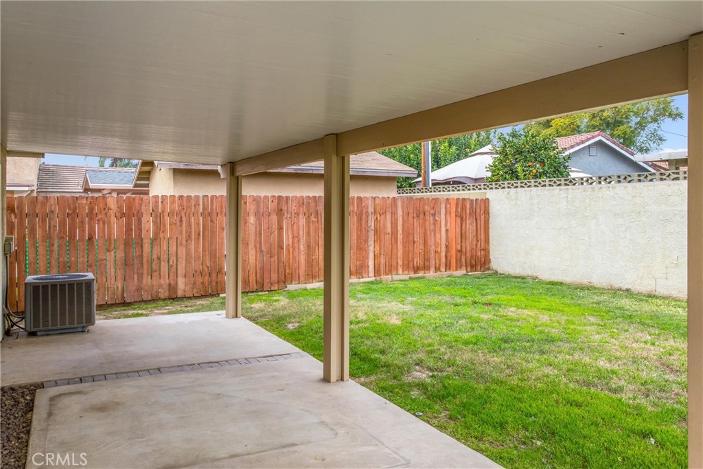 22246 Cardinal Street Grand Terrace, CA 92313 - Photo 23 of 28 a view of a backyard with wooden fence