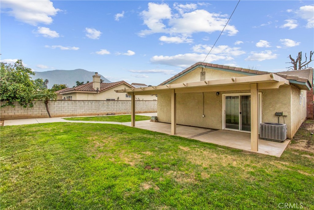 22246 Cardinal Street Grand Terrace, CA 92313 - Photo 27 of 28 a front view of a house with a yard