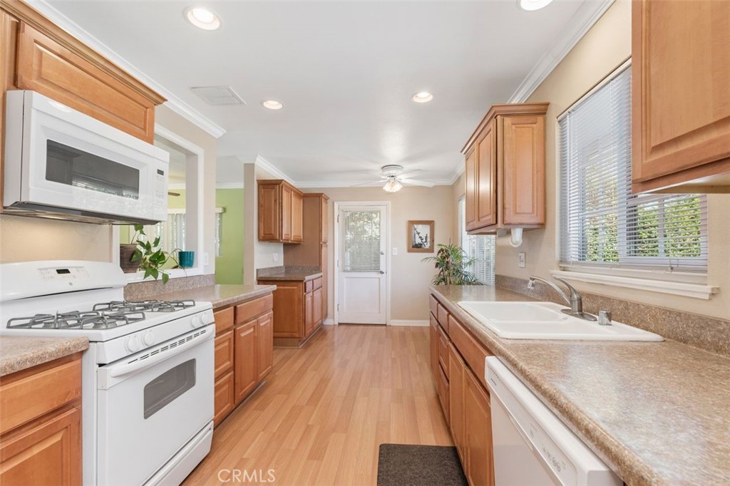 5402 Scott Avenue Riverside, CA 92504 - Photo 1 of 1 a kitchen with stainless steel appliances granite countertop a sink stove and refrigerator