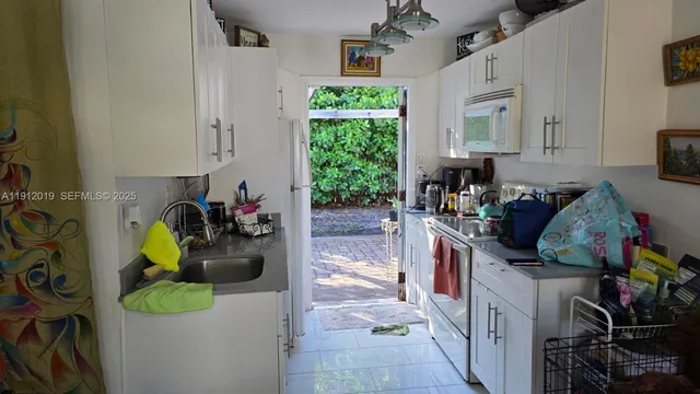 a view of a door and chair in the balcony